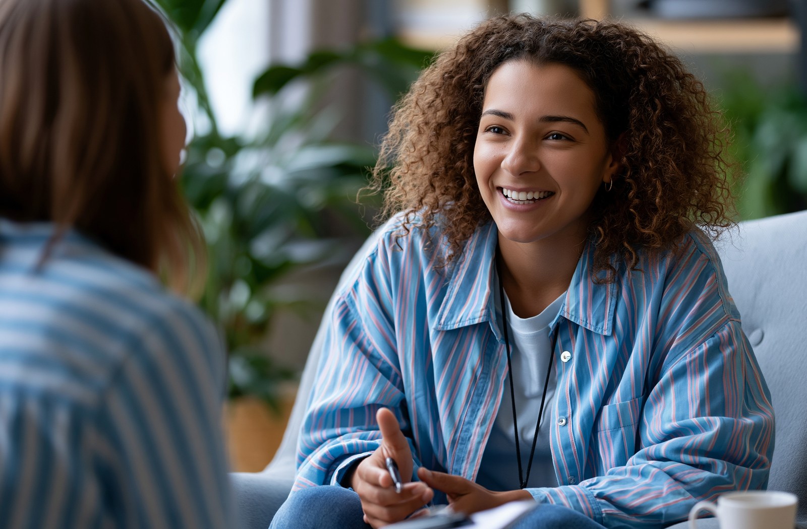 Young adult woman in an anxiety and OCD therapy session with her therapist